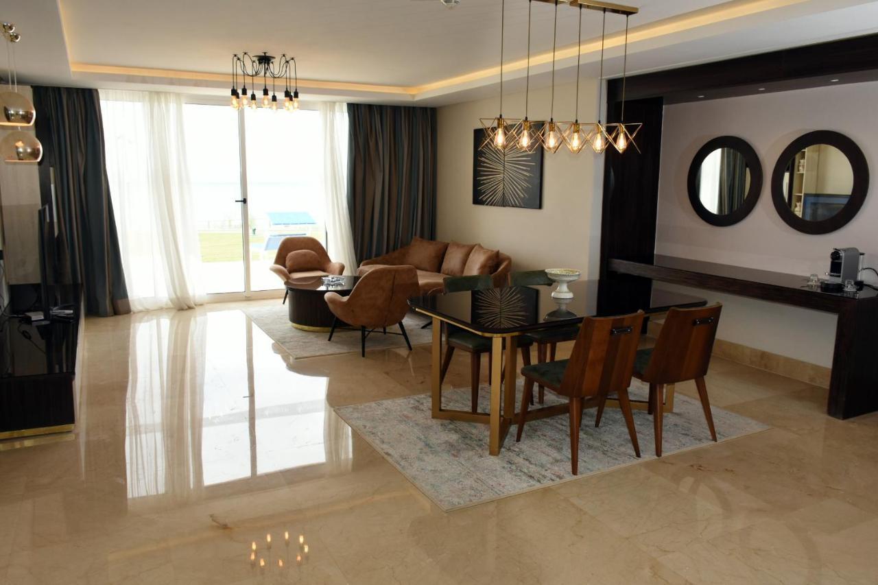 Pickalbatros White Beach Taghazout (Adults Only) Esterno foto A living room in a luxury apartment
